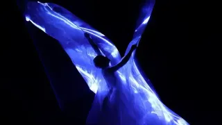 Iris Van Herpen unveils 'living' couture dress of bioluminescent algae in Paris