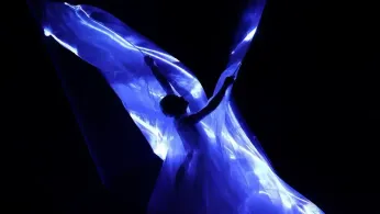 Iris Van Herpen unveils 'living' couture dress of bioluminescent algae in Paris